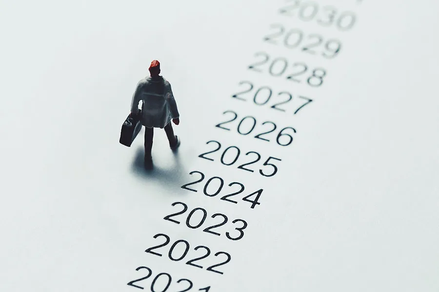 Business owner walking along timeline 2025 and beyond