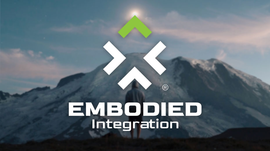 Embodied Integration Logo in front of mountain range
