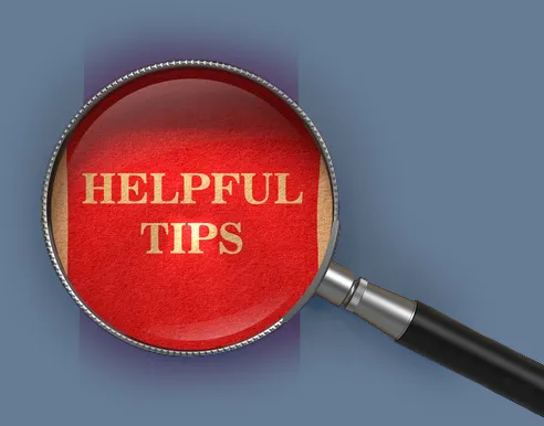 Magnifying glass hovering over the words "Helpful Tips"